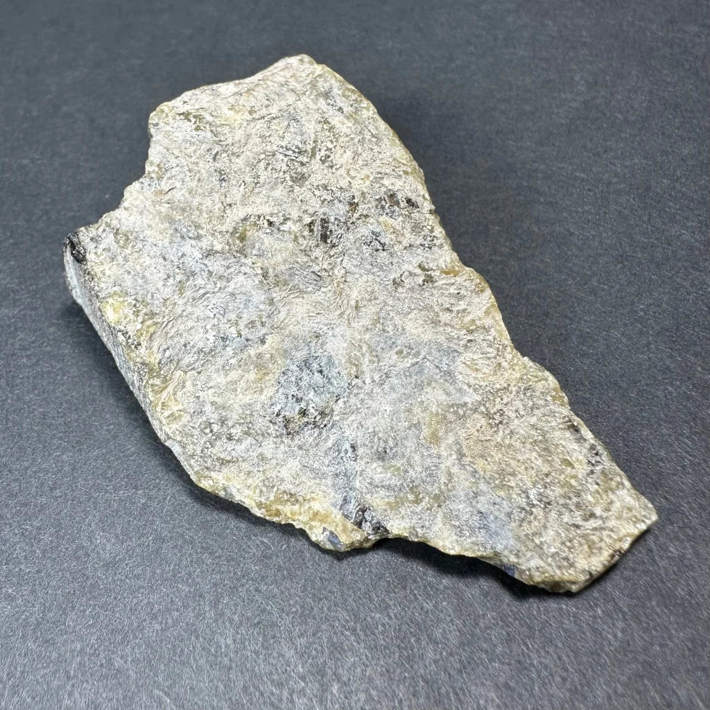 Rough silvery-gray Madagascar labradorite crystal specimen with yellow hints