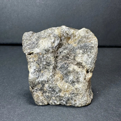 Rough gray Madagascar labradorite crystal with speckled tones