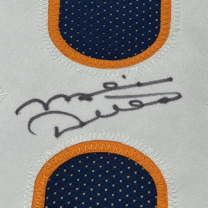 White fabric panel with orange and blue polka dots and a black signature for Bears jersey display