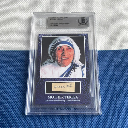 Collectible Mother Teresa trading card with handwritten words in a clear protective case