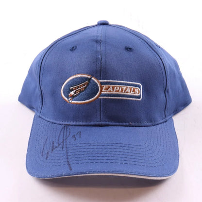 Blue Washington Capitals cap with a signature on the brim and the capitals logo