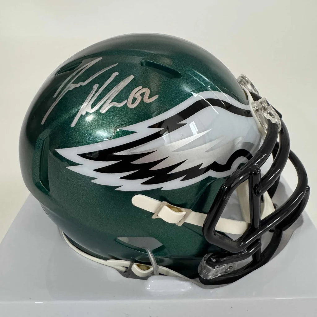Green Philadelphia Eagles mini helmet with silver autograph, perfect for fans and collectors