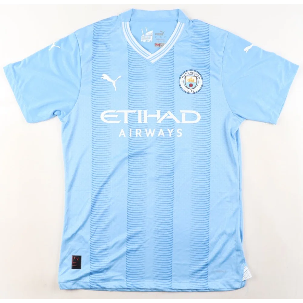 Light blue Puma jersey with white accents signed by Ruben Dias Manchester City