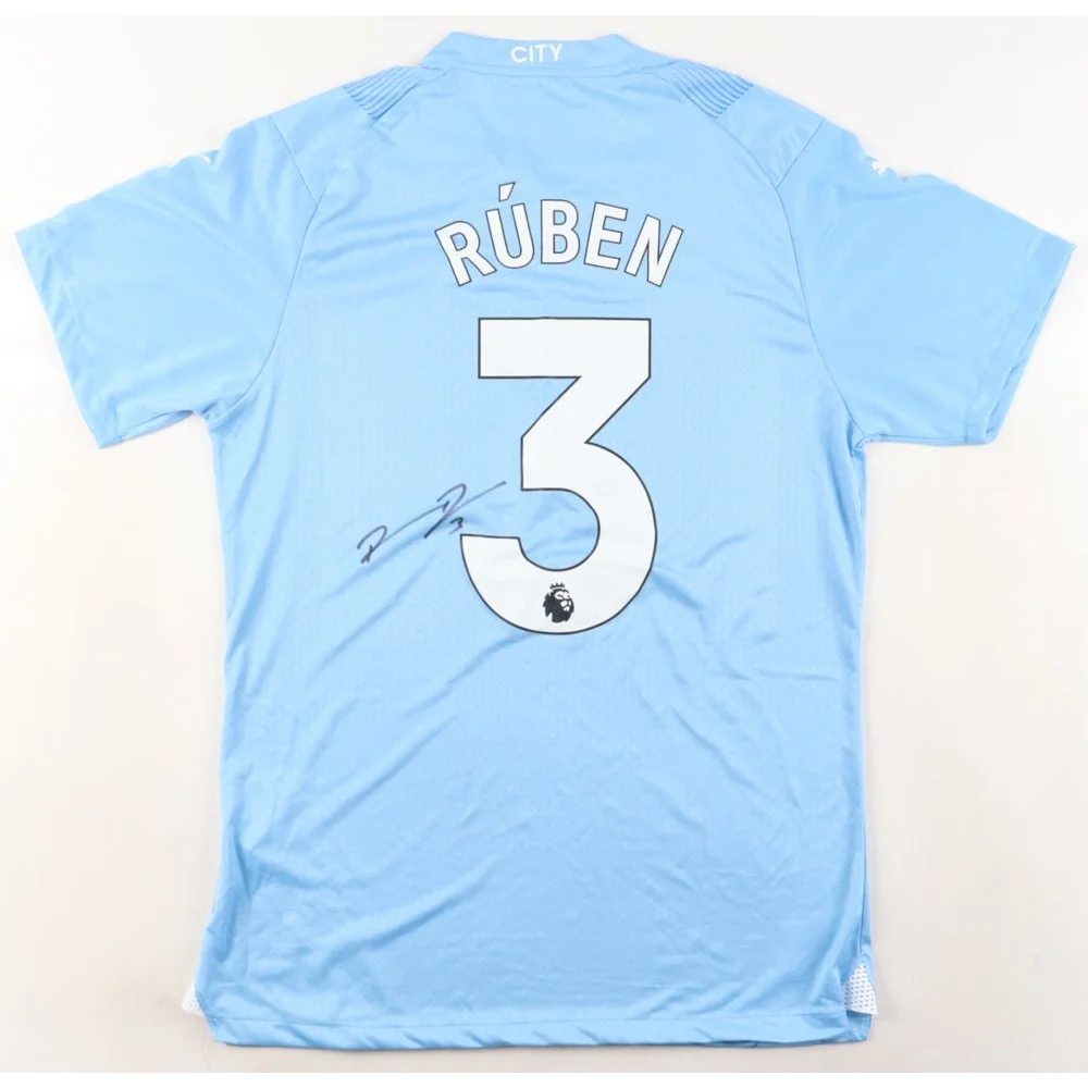Light blue PUMA jersey signed by Ruben Dias with RÚBEN and 3 on the back