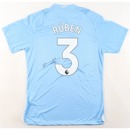 Light blue PUMA jersey signed by Ruben Dias with RÚBEN and 3 on the back