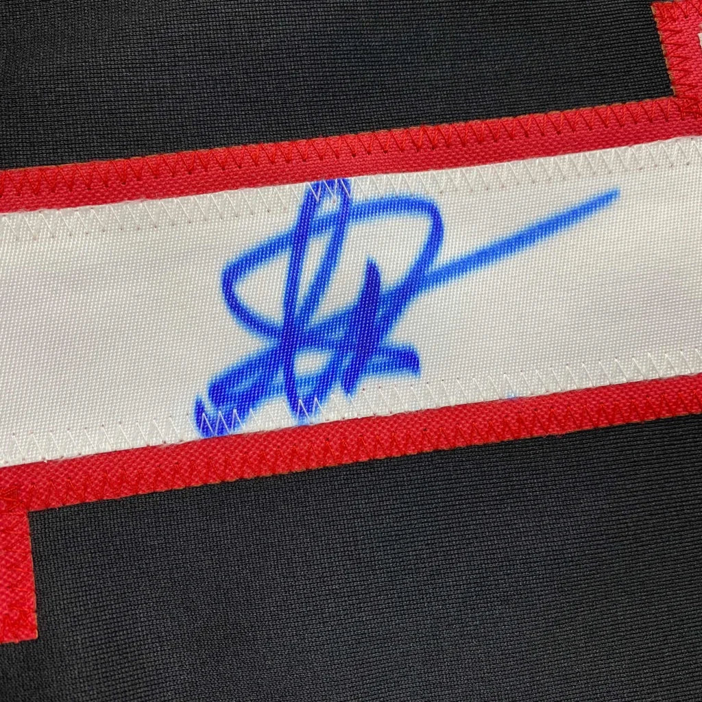 Black fabric with a white strip, red outline, and blue autograph on YAN Number 1 Jersey