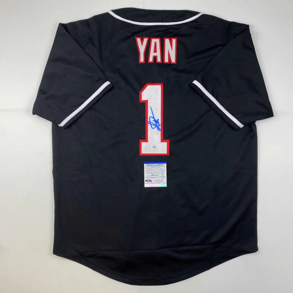 Black baseball jersey with YAN and 1 in red and white, signed in blue for sale