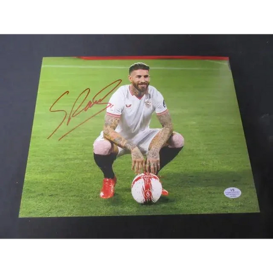 Autographed signed 8x10 photo of male soccer player in white uniform with ball