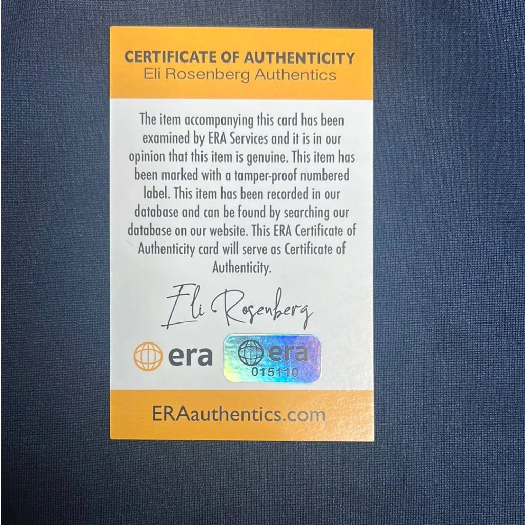Certificate of authenticity from Eli Rosenberg Authentics with holographic sticker for official Tom Brady jersey