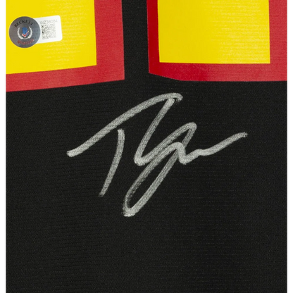 Autographed Trae Young Fanatics Jersey with black, yellow, and red accents and COA