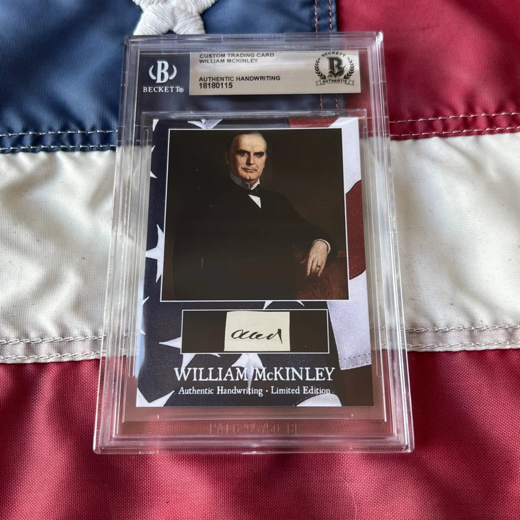A framed custom trading card featuring authentic william mckinley handwriting and portrait in clear protective packaging