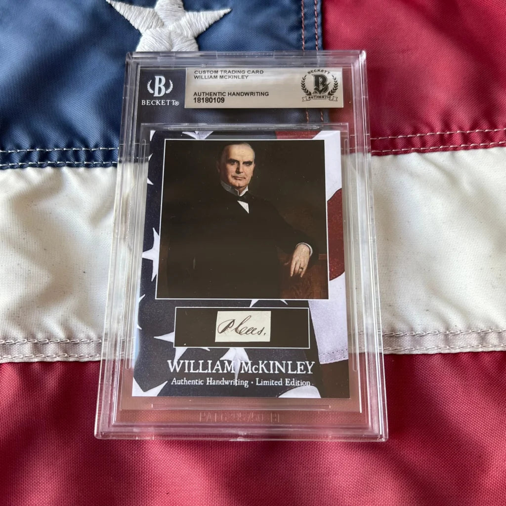A framed authentic william mckinley 25th president trading card with handwriting in clear protective packaging