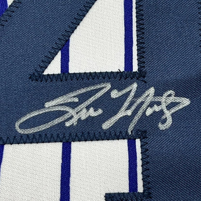 Autographed dark blue and white striped Baseball Jersey ready to hang on your wall