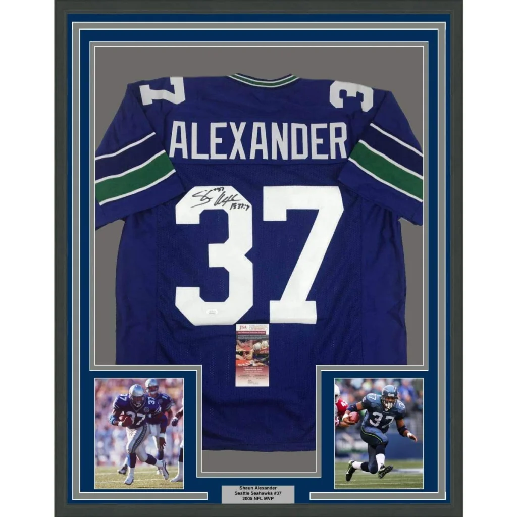 Framed autographed blue and white football jersey with green accents