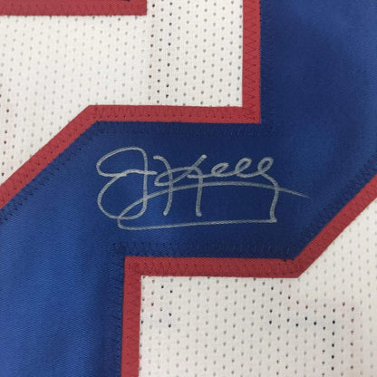 Autographed white custom jersey with blue red trim from Kelly 12 football team