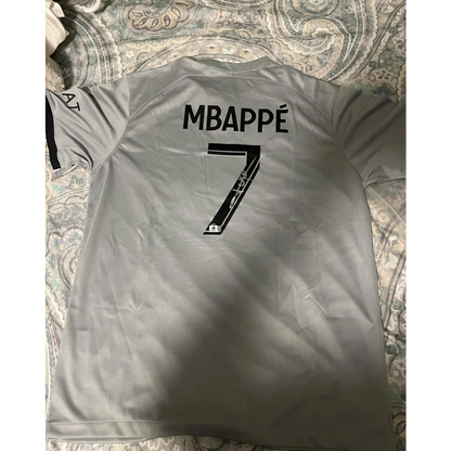 Gray kylian mbappe PSG jersey with autographed kylian mbappe and number 7 on back