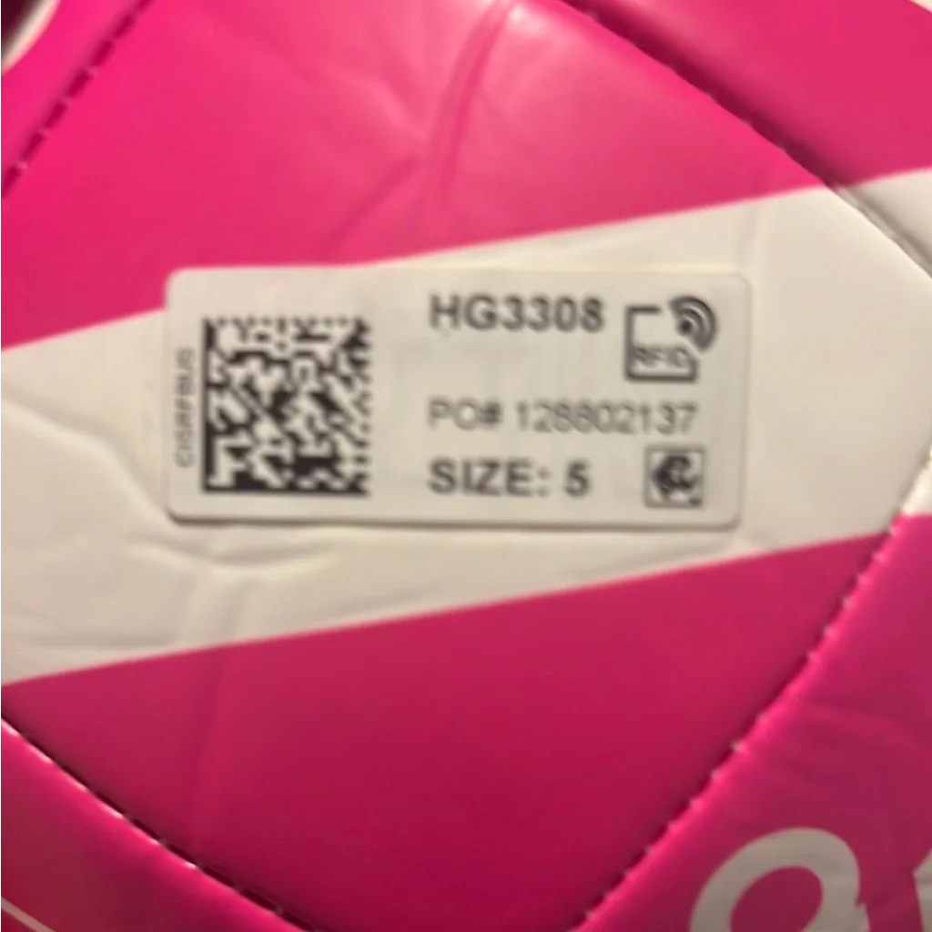 Pink and white striped soccer ball with RFID tag from Autographed Leo Messi Adidas collection