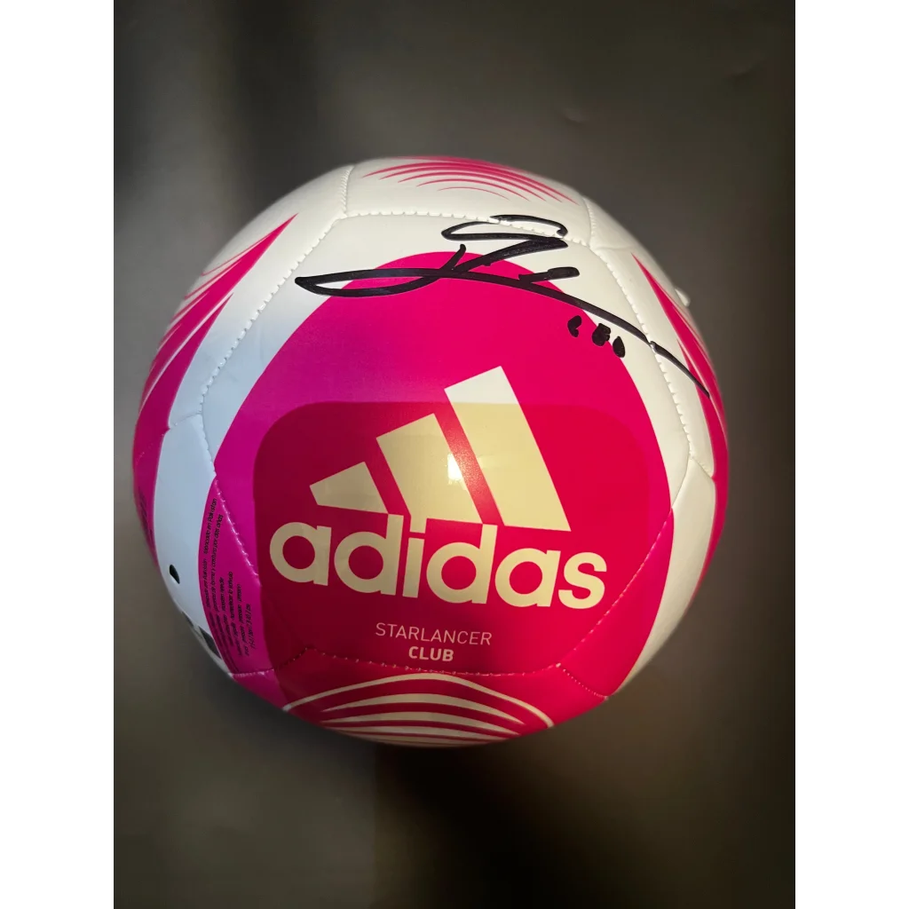 Pink and white Adidas Starlancer Club soccer ball autographed by Leo Messi for Messi Adidas soccer fans