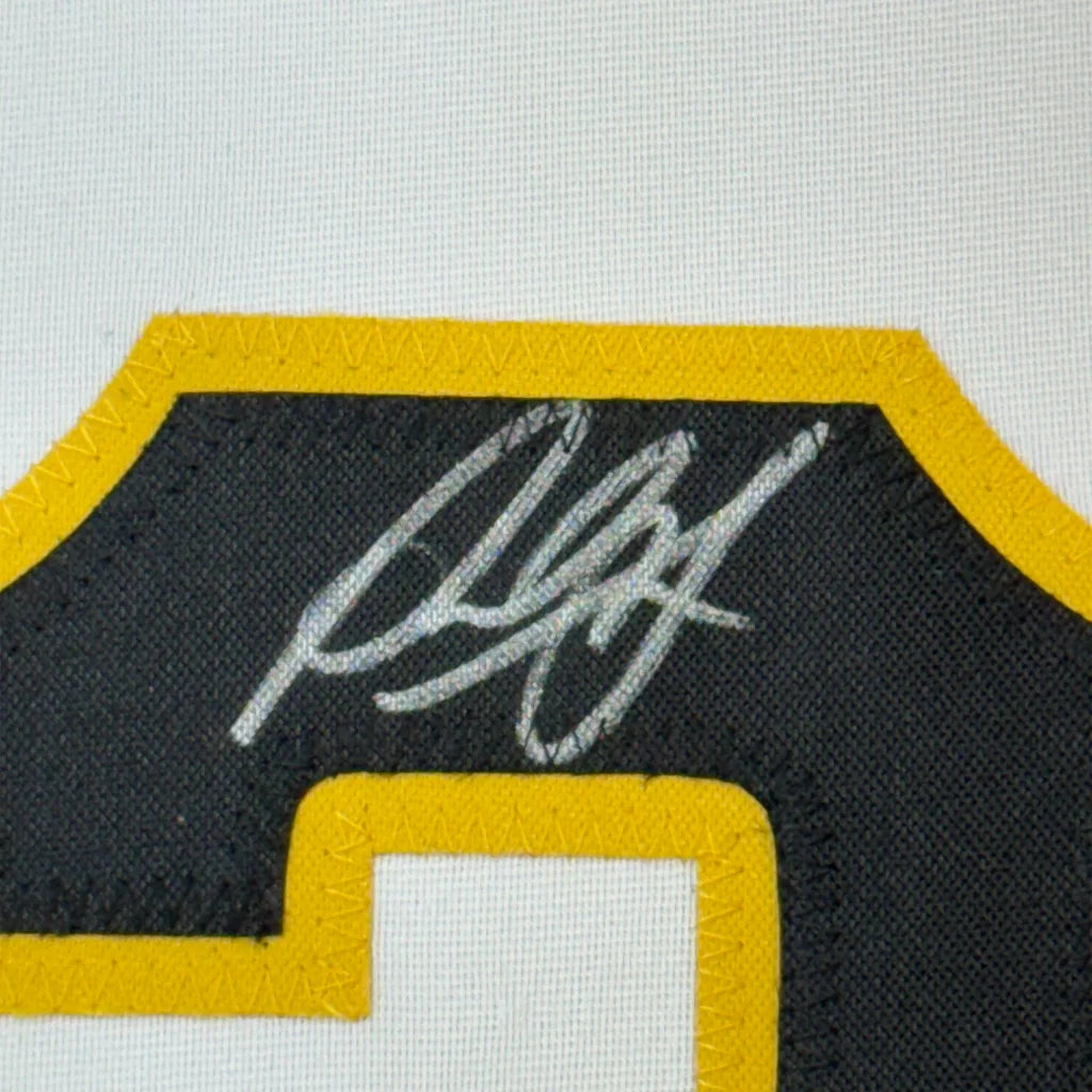Autographed black and yellow Paul Skenes sports jersey ready to hang