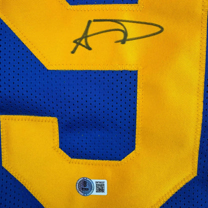 Blue and yellow custom jersey from a professional sports league with autograph and hologram