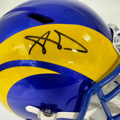 Blue and yellow LA Rams helmet with black autograph, third party authentication included