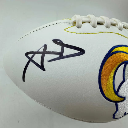 White Los Angeles Rams football with black autograph and third party authentication