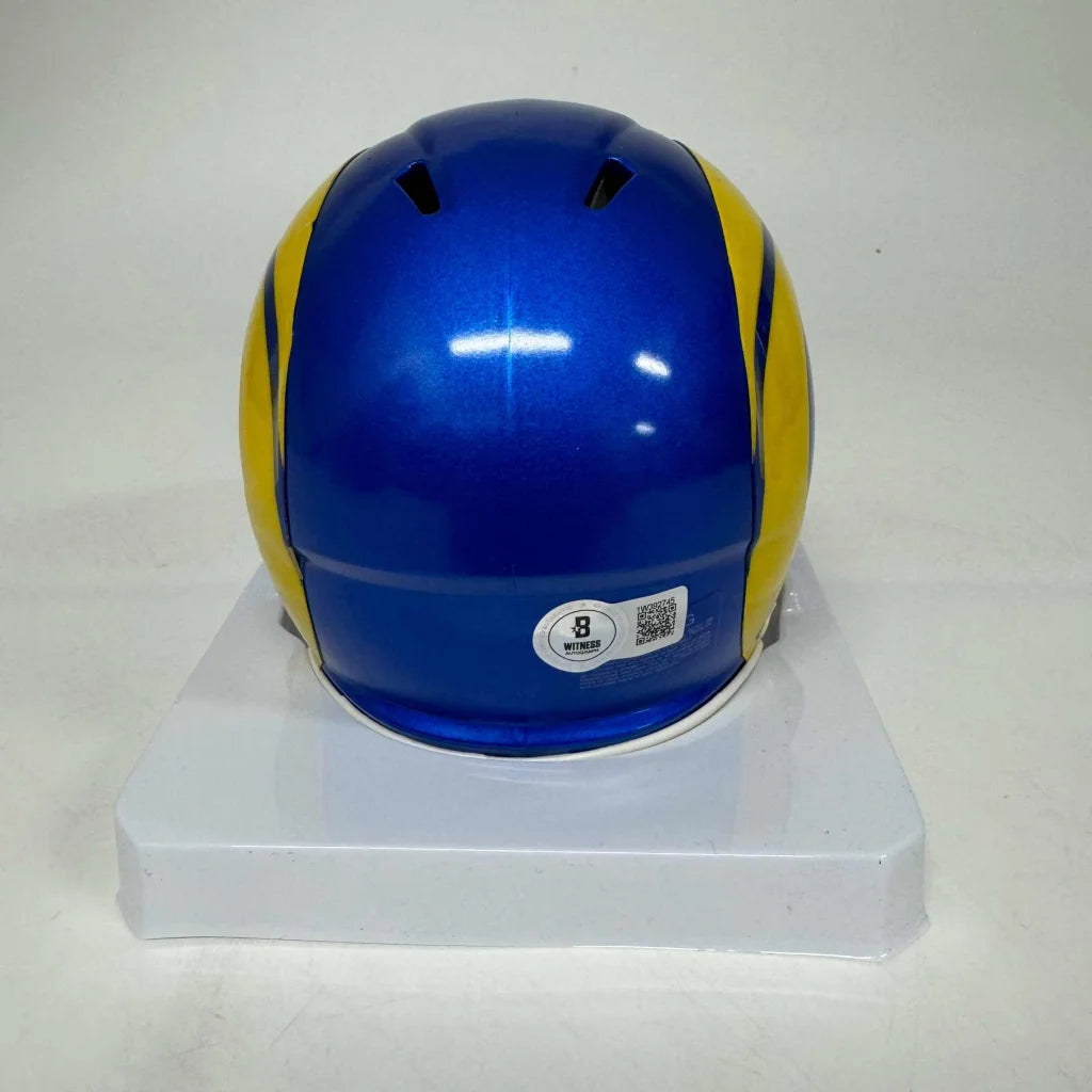 Blue and yellow football helmet from the Authentic Autographed Los Angeles Rams Mini Helmet with Display Case