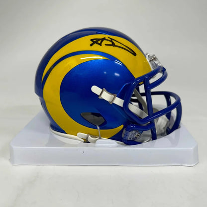 Blue and yellow Los Angeles Rams mini helmet with black autograph in display case