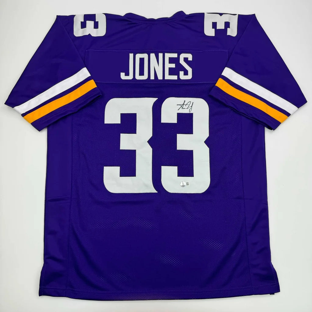 Purple custom jersey with white and gold stripes, JONES 33 signature for professional sports