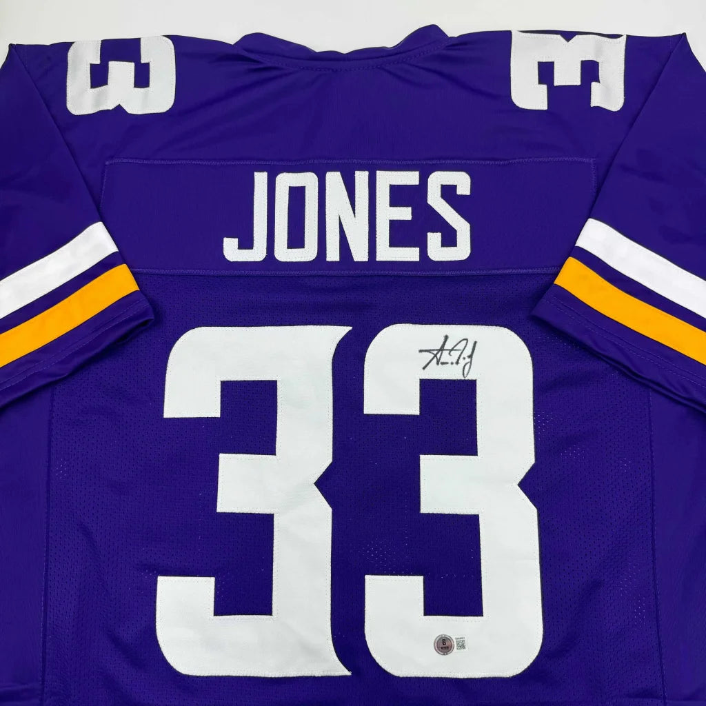 Purple custom jersey with white numbers and autograph from a professional sports league