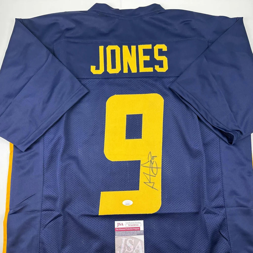 Navy blue custom sports jersey with JONES 9 autograph and authentication sticker from Professional Sports League