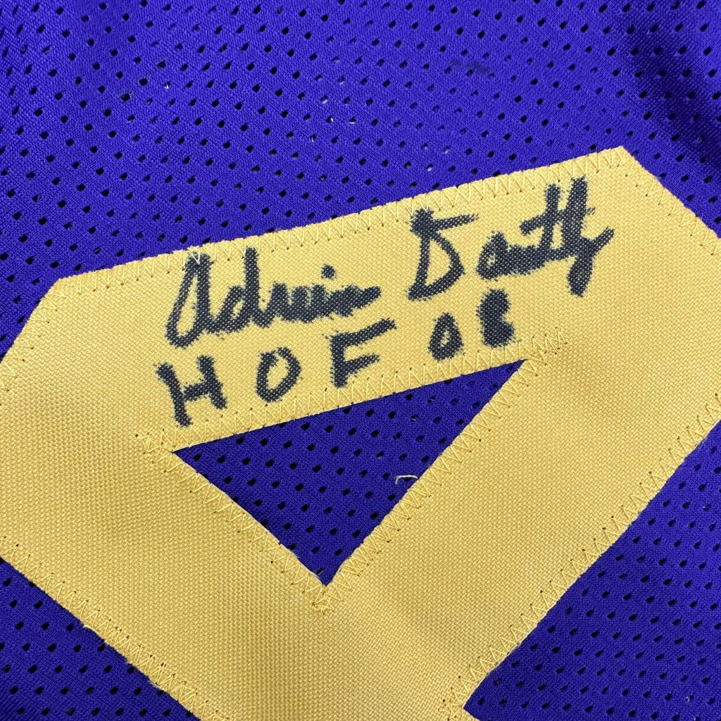 Purple custom jersey with gold trim and black autograph from a pro sports league icon