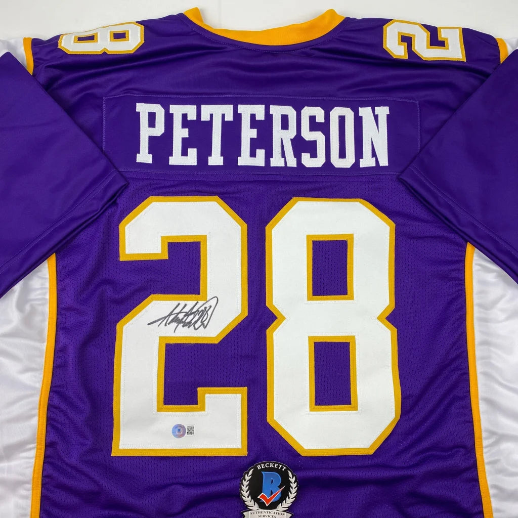 Signed purple and gold football jersey from a professional sports league display
