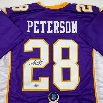 Signed purple and gold football jersey from a professional sports league display