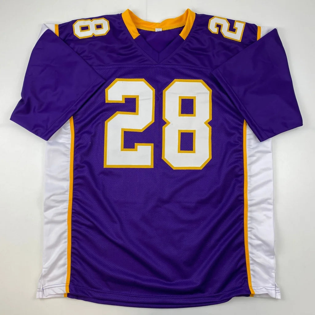 Purple and white football jersey with gold trim from Adrian Peterson Signed Vikings jersey in professional sports league