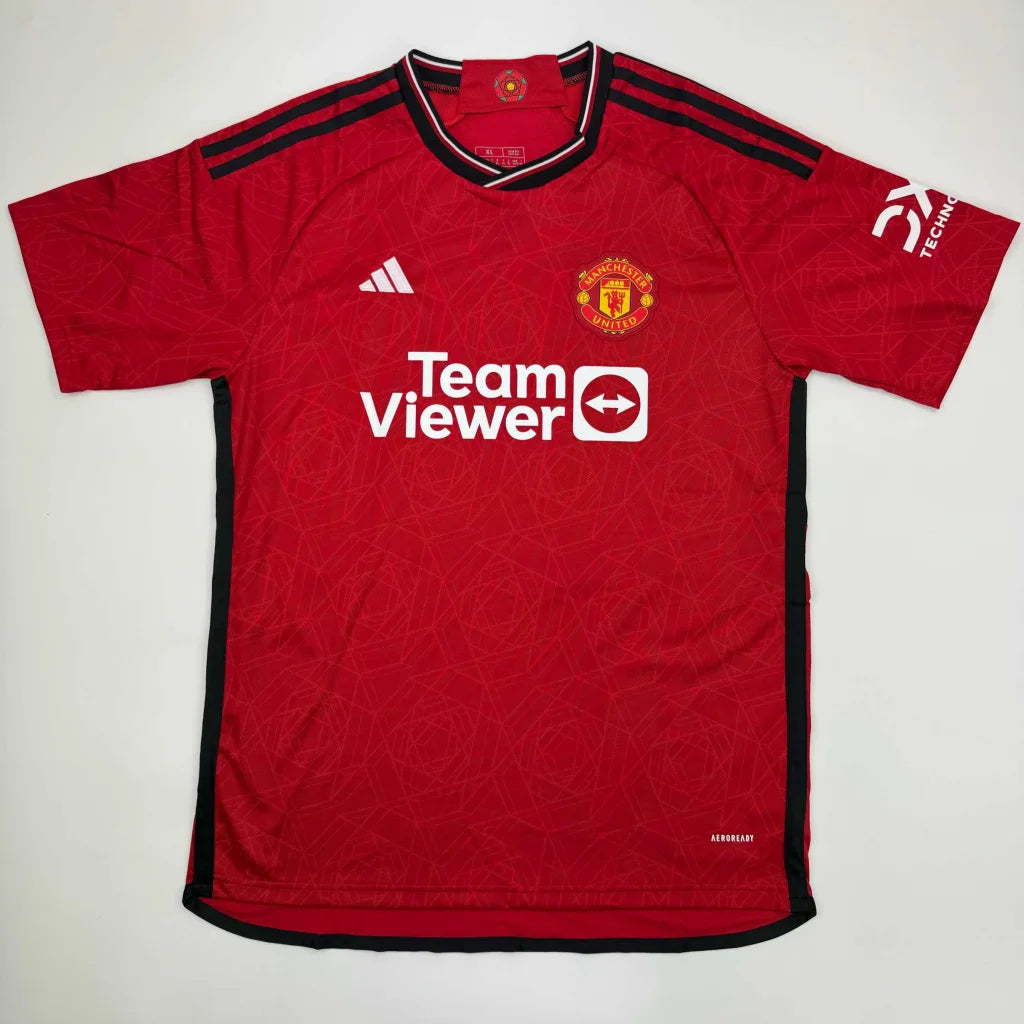 Red Manchester United football jersey with black accents from signed GARNACHO 17 professional sports league