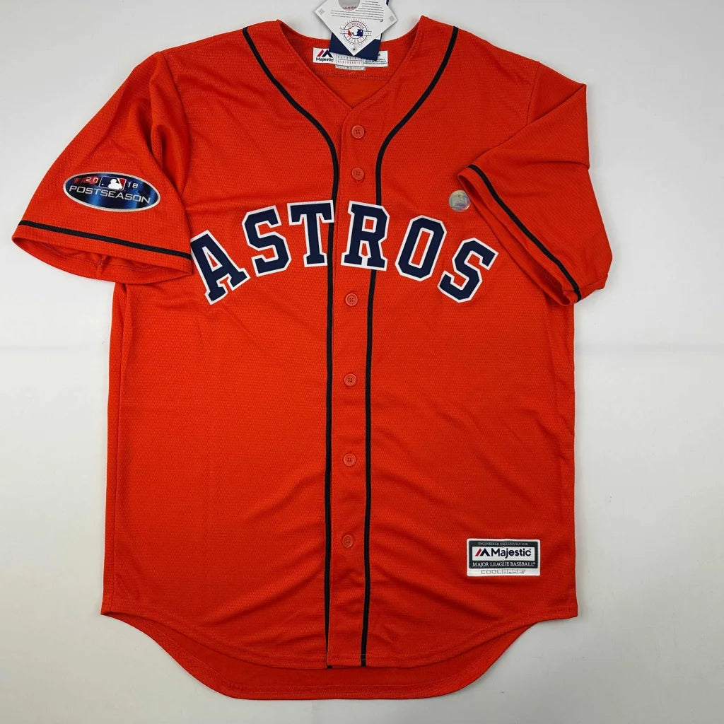 Orange Houston Astros jersey with dark blue lettering from Alex Bregman signed and Beckett BAS certified