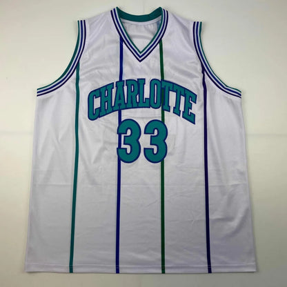 White Alonzo Mourning custom jersey with teal and purple accents from professional sports league
