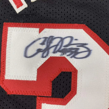 Black athletic custom jersey with red white numbers and dark blue autograph for pro sports