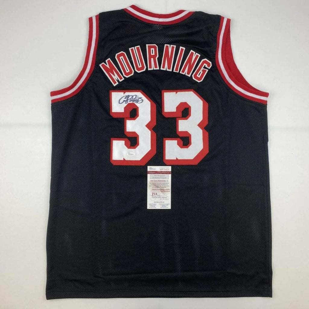 Black custom jersey signed by Alonzo Mourning, perfect for professional sports fans