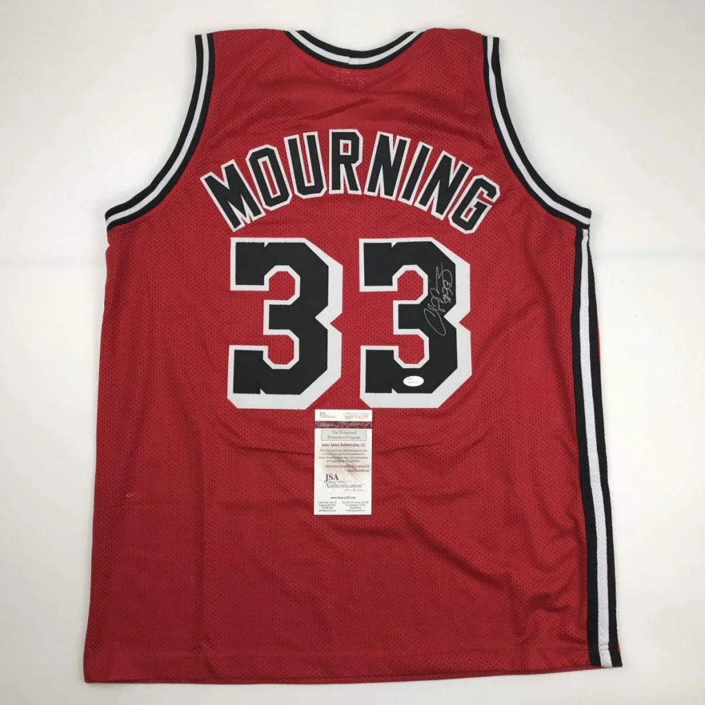 Autographed Alonzo Mourning custom jersey in red mesh with black and white trim, number 33, professional sports league