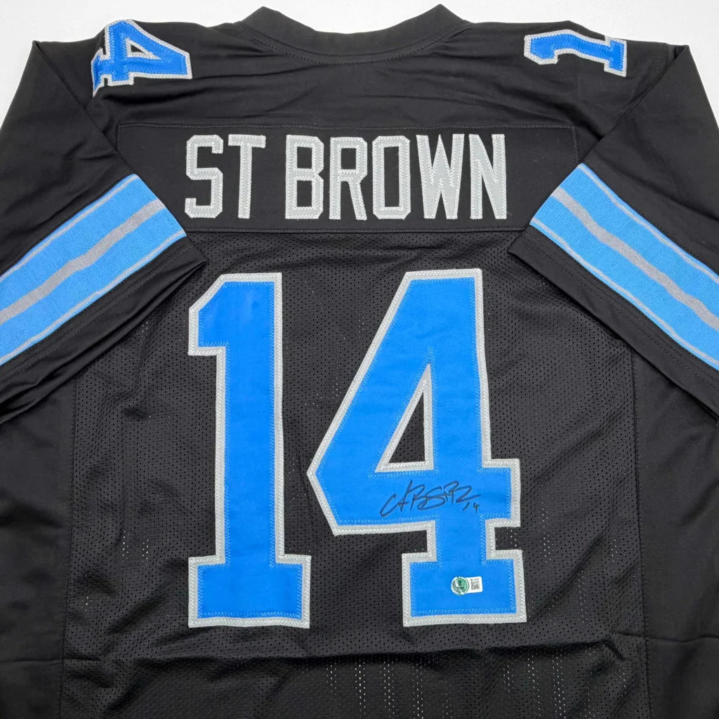 Autographed Amon-Ra St. Brown Detroit Black Football Jersey Beckett BAS COA | Certified Authentic Signed Memorabilia | vintageantiquesgifts.com