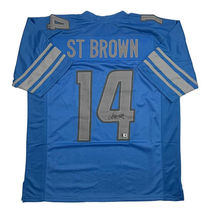 Autographed Amon-Ra St. Brown Detroit Blue Football Jersey Beckett BAS COA | Hall of Fame Sports Memorabilia | vintageantiquesgifts.com