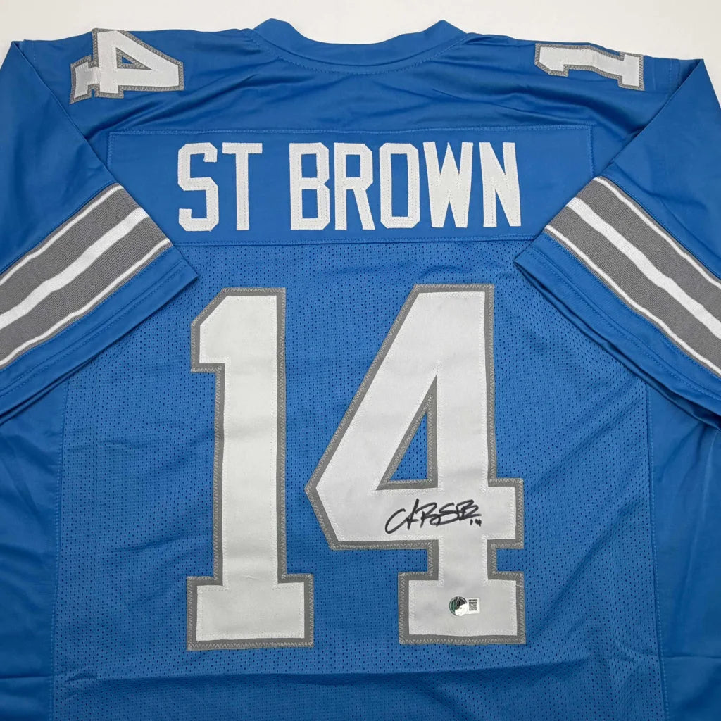 Autographed Amon-Ra St. Brown Detroit Current Blue Football Jersey Beckett BAS COA | Certified Authentic Signed Memorabilia | vintageantiquesgifts.com