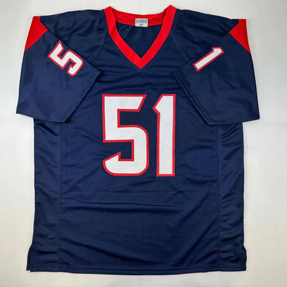 Navy blue custom football jersey with red and white accents number 51 autographed by will anderson jr professional sports league