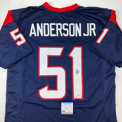 Back view of autographed navy blue and red houston texans custom jersey with white number 51 and name anderson jr. professional sports league collectible