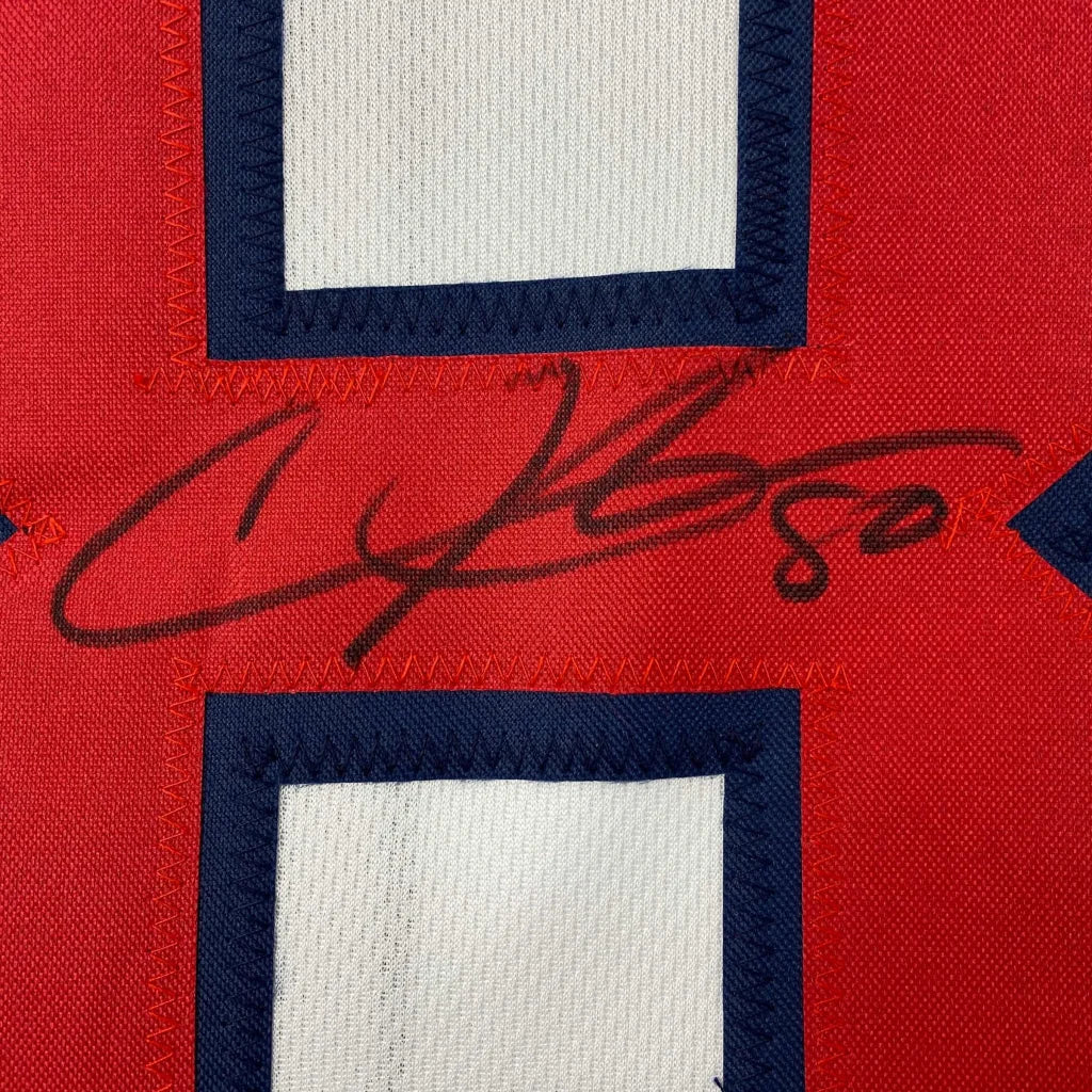 Red custom jersey from Professional Sports League with black marker autograph