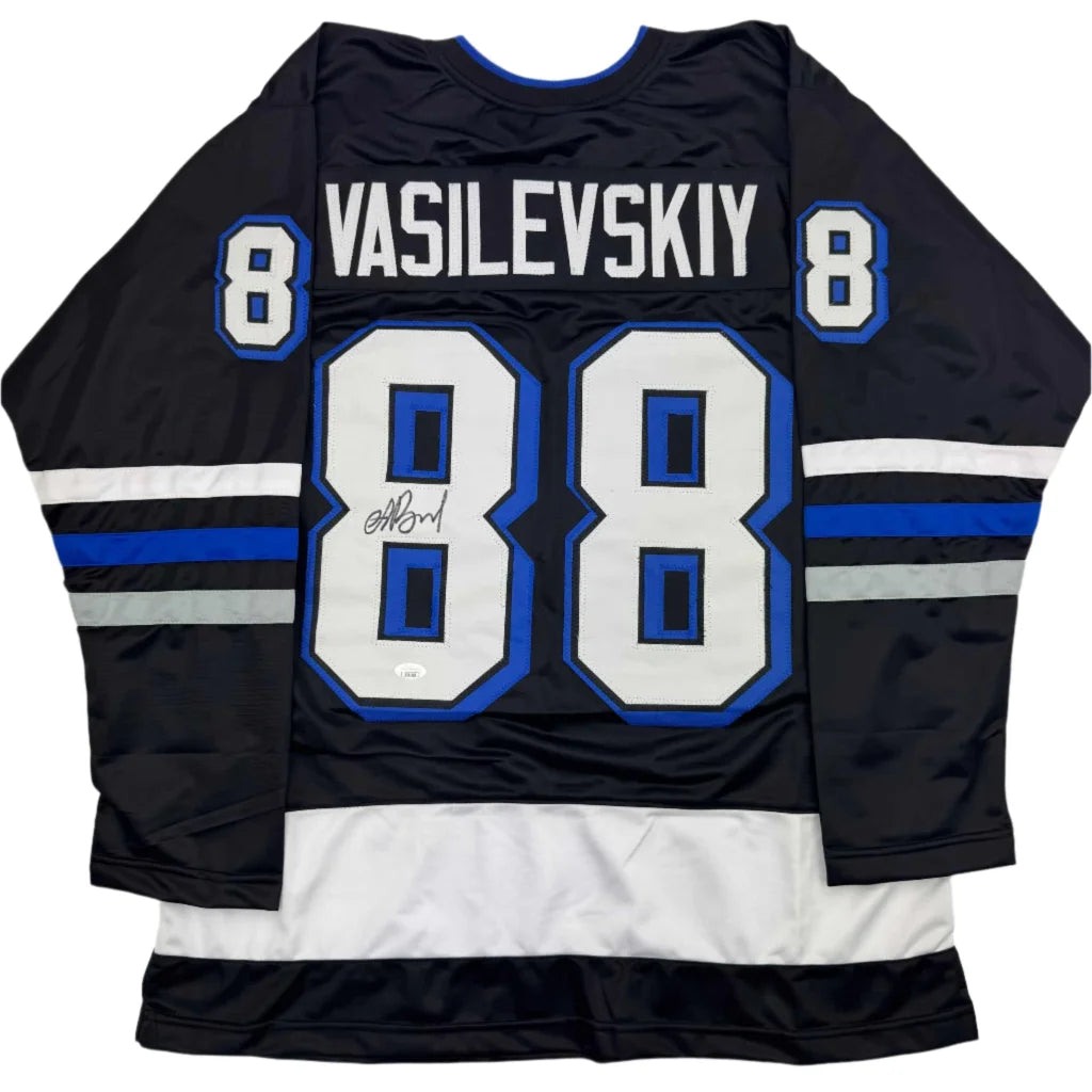 Black custom jersey with blue white accents and autograph from a professional sports league