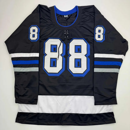 Black custom hockey jersey with blue and white accents and number 88 from professional sports league