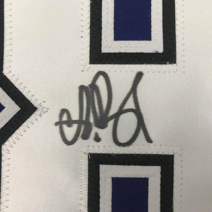 White fabric with stitched black and blue patches and a dark gray signature on Vasilevskiy 88 jersey
